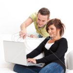 stock-photo-13758766-friends-using-laptop