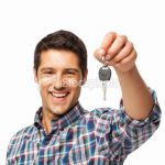 stock-photo-20988464-young-man-holding-car-key-isolated